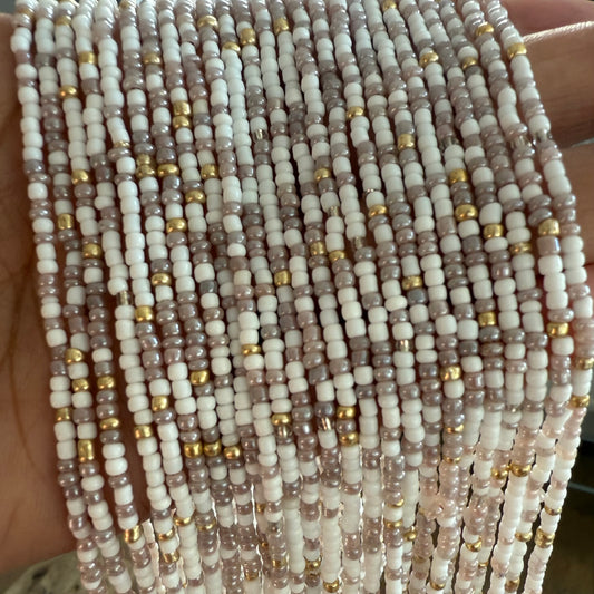 Close-up of multi-coloured waist beads. tie on and clasp waist beads for women