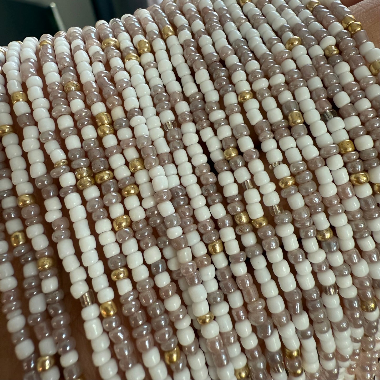 Close-up of multi-coloured waist beads. tie on and clasp waist beads for women